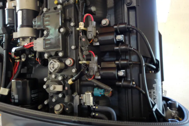 Slide: The Image of Close-up of a 2012 Hurricane SunDeck 217 OB engine components and wiring. - 43