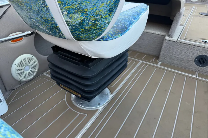 Slide: The Image of 2003 Crestliner Tournament 202 SC boat interior with patterned seat and speaker. - 29