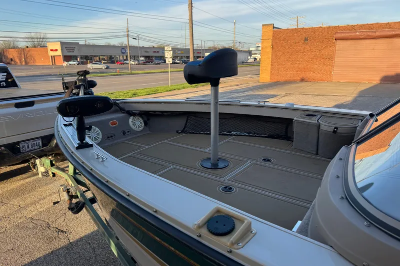 Slide: The Image of 2003 Crestliner Tournament 202 SC boat parked, featuring spacious deck and fishing seat. - 11