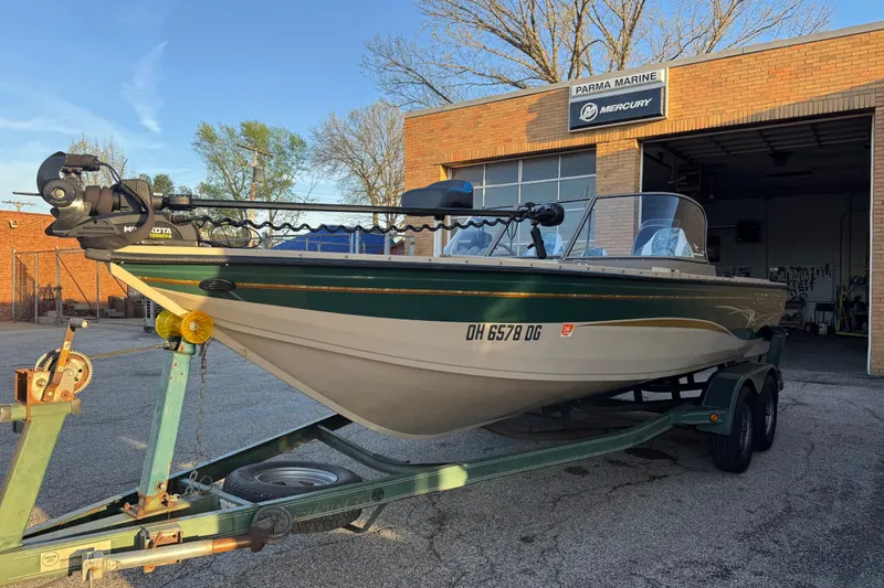 Slide: The Image of 2003 Crestliner Tournament 202 SC boat on trailer outside Parma Marine shop. - 12