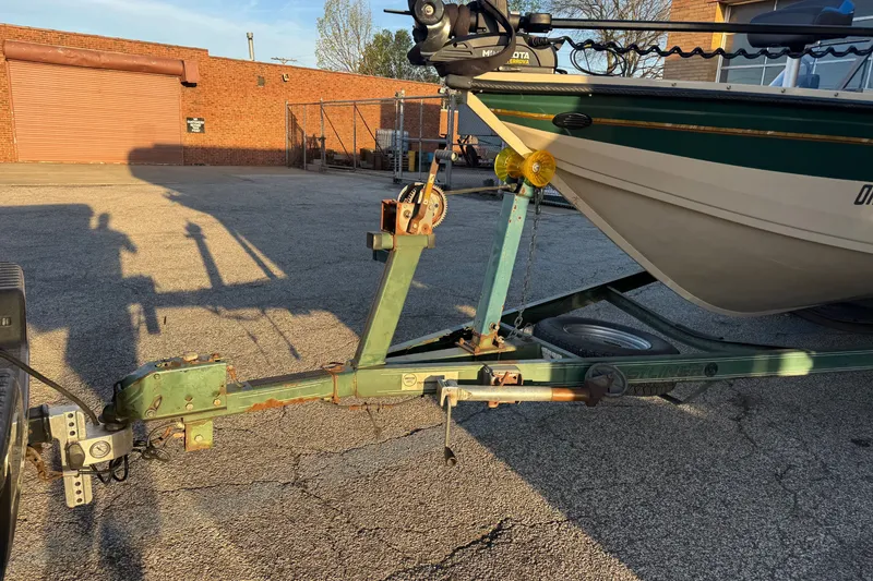 Slide: The Image of 2003 Crestliner Tournament 202 SC boat trailer hitch in a parking lot. - 13