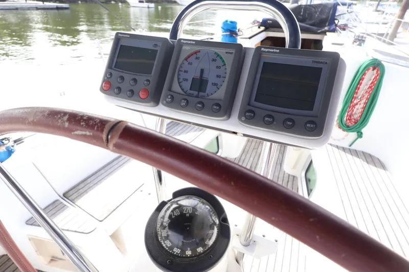 Slide: The Image of Steering wheel and navigation instruments on a 2008 Jeanneau Sun Odyssey 36i sailboat. - 9
