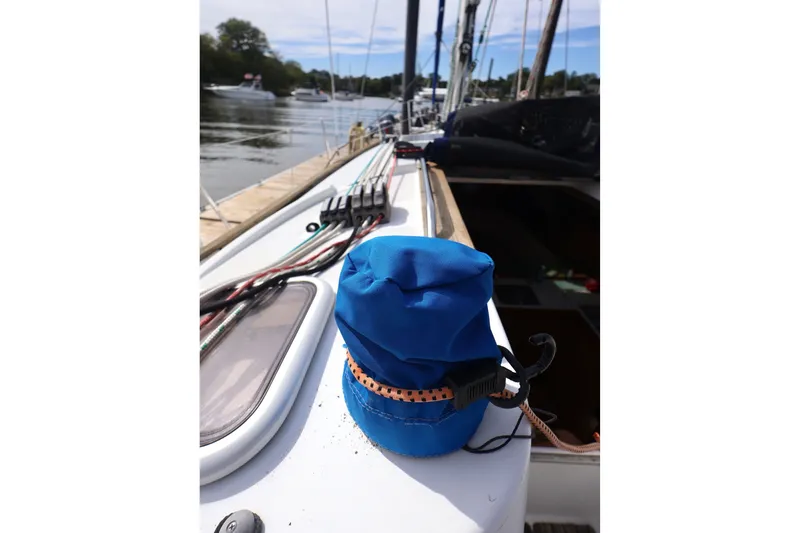 Slide: The Image of Blue sail cover on Jeanneau Sun Odyssey 36i deck, 2008 model, docked by the water. - 6