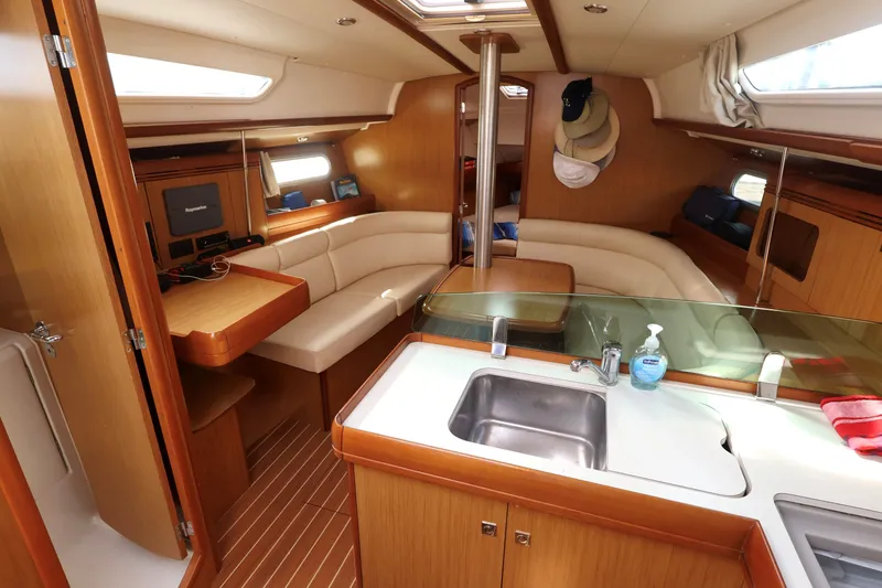 Slide: The Image of Interior of 2008 Jeanneau Sun Odyssey 36i yacht with cozy seating and modern amenities. - 10