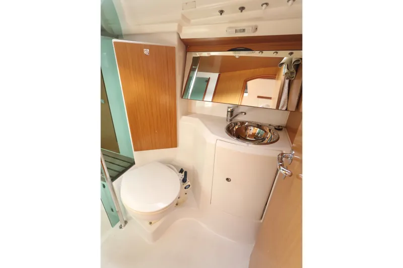 Slide: The Image of Compact bathroom in 2008 Jeanneau Sun Odyssey 36i yacht with sink and toilet. - 19