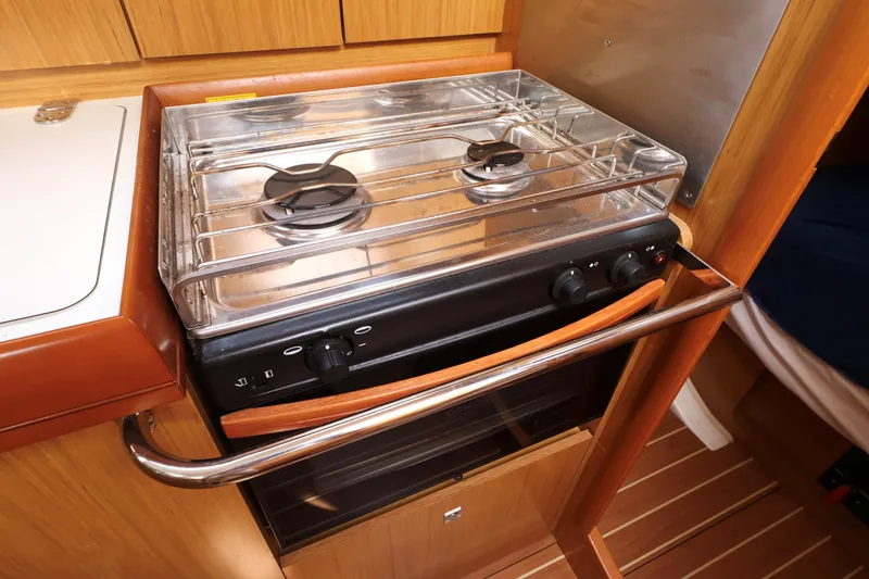 Slide: The Image of Compact kitchen stove in 2008 Jeanneau Sun Odyssey 36i yacht interior. - 14