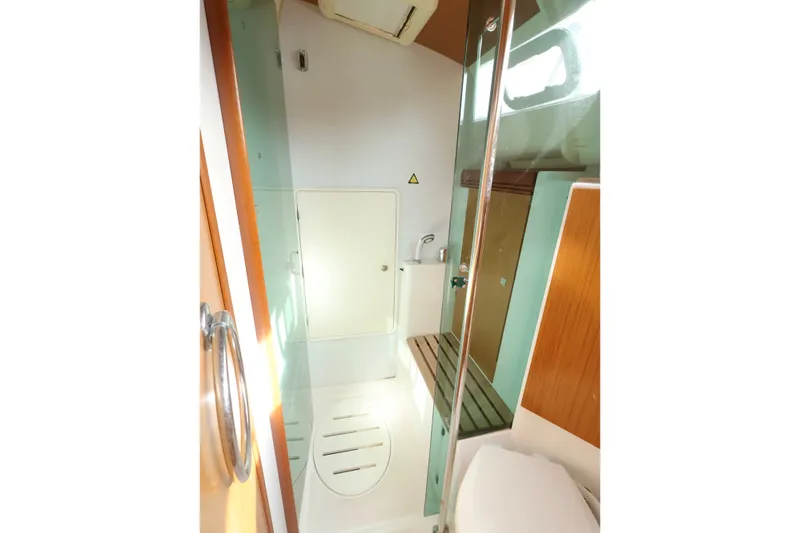 Slide: The Image of Bathroom interior of 2008 Jeanneau Sun Odyssey 36i yacht, featuring shower and wooden accents. - 20