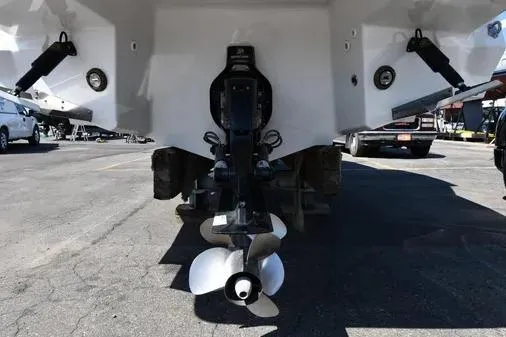 Slide: The Image of 2021 Monterey 278SS Super Sport boat stern with dual propellers in a parking lot. - 32