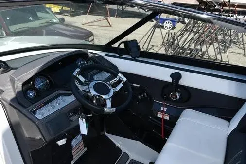 Slide: The Image of 2021 Monterey 278SS Super Sport boat interior with steering wheel and control panel. - 22