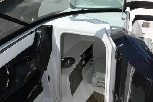 Slide: The Image of 2021 Monterey 278SS Super Sport boat interior with compact restroom and sink. - 31