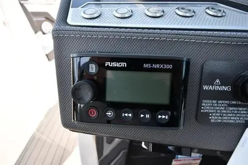 Slide: The Image of Fusion MS-NRX300 stereo system on 2021 Monterey 278SS Super Sport boat dashboard. - 29