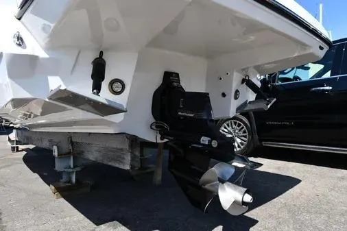 Slide: The Image of 2021 Monterey 278SS Super Sport boat stern with outboard motor, parked on a trailer. - 33