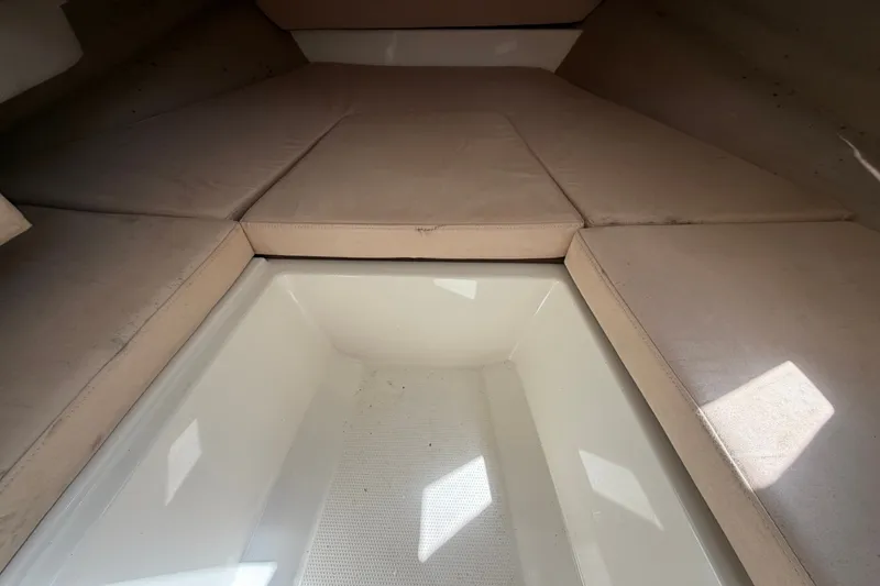Slide: The Image of Interior cabin of 2021 Parker Poland 690 Sport boat with beige cushions. - 37