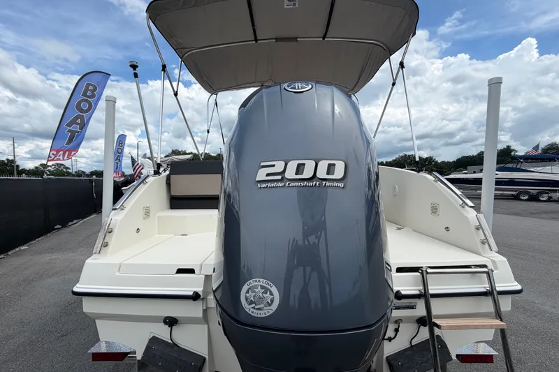 Slide: The Image of 2021 Parker Poland 690 Sport boat with 200 horsepower engine at a sales lot. - 3