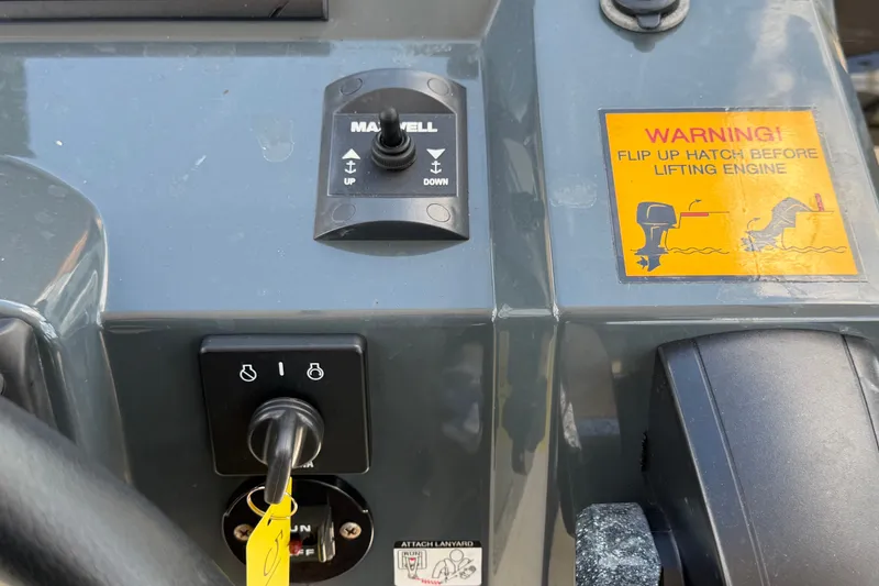 Slide: The Image of Control panel of a 2021 Parker Poland 690 Sport boat with warning label. - 26