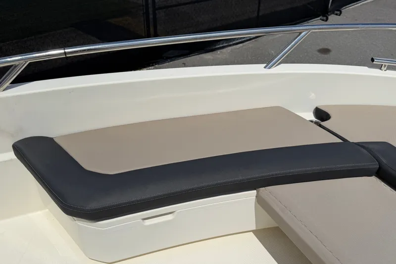 Slide: The Image of Parker Poland 690 Sport 2021 boat seating with beige and black cushions. - 44