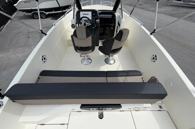 Slide: The Image of 2021 Parker Poland 690 Sport boat interior with seating and steering console. - 10