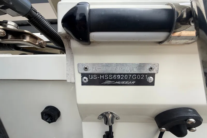 Slide: The Image of Parker Poland 690 Sport 2021 boat identification plate with serial number and Hussar branding. - 78