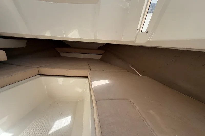 Slide: The Image of Interior cabin of 2021 Parker Poland 690 Sport boat with beige cushions. - 36