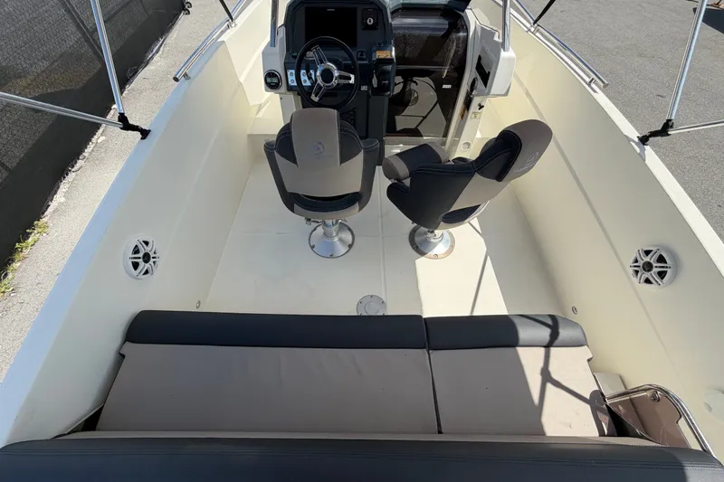 Slide: The Image of Interior view of 2021 Parker Poland 690 Sport boat with seating and steering console. - 14
