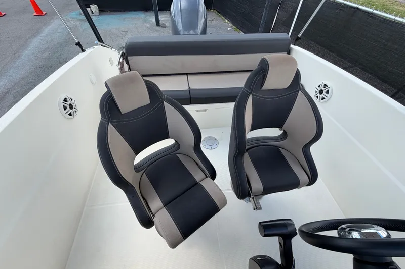 Slide: The Image of Interior of 2021 Parker Poland 690 Sport boat with modern seating and steering wheel. - 62