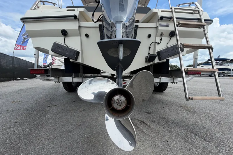 Slide: The Image of Rear view of 2021 Parker Poland 690 Sport boat with propeller and ladder. - 4