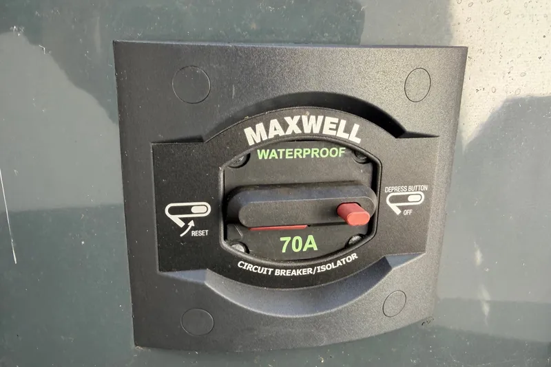 Slide: The Image of A Maxwell waterproof switch with a 70A circuit breaker on a Parker Poland 690 Sport boat. - 30