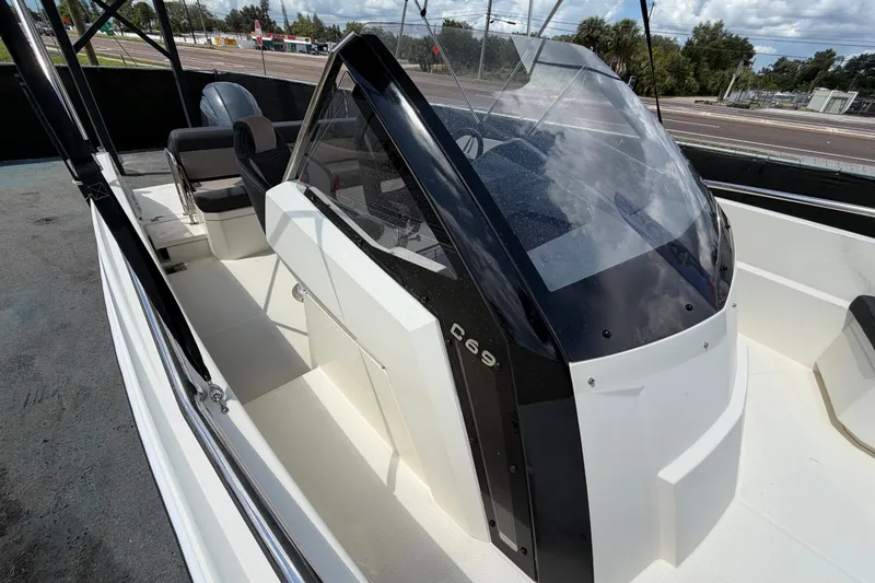 Slide: The Image of 2021 Parker Poland 690 Sport boat with sleek design and modern cockpit. - 60