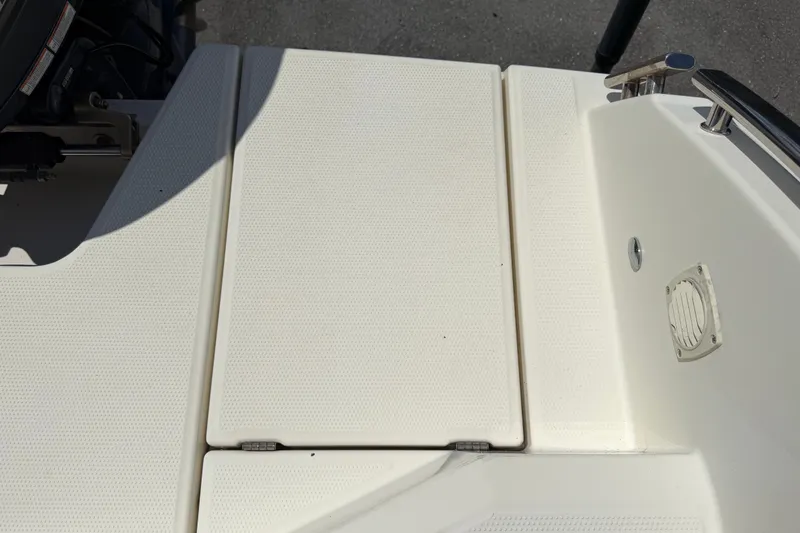 Slide: The Image of 2021 Parker Poland 690 Sport boat deck with textured surface and fittings. - 75