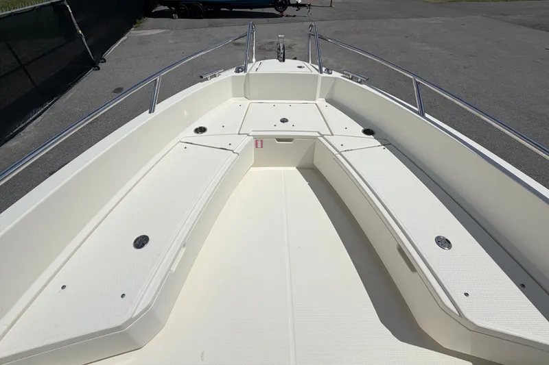 Slide: The Image of Bow view of 2021 Parker Poland 690 Sport boat, featuring spacious seating and sleek design. - 43