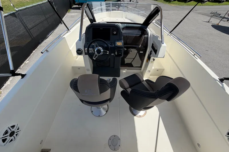 Slide: The Image of Interior view of 2021 Parker Poland 690 Sport boat cockpit with dual seats and steering console. - 15