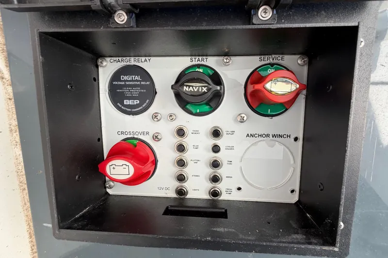 Slide: The Image of Electrical control panel with switches for start, service, and anchor winch, plus digital displays. - 29