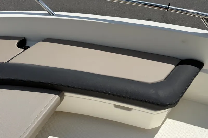 Slide: The Image of Parker Poland 690 Sport 2021 boat seating with beige and black cushions. - 52