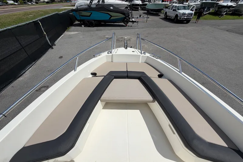 Slide: The Image of 2021 Parker Poland 690 Sport boat with spacious seating area at a marina. - 42