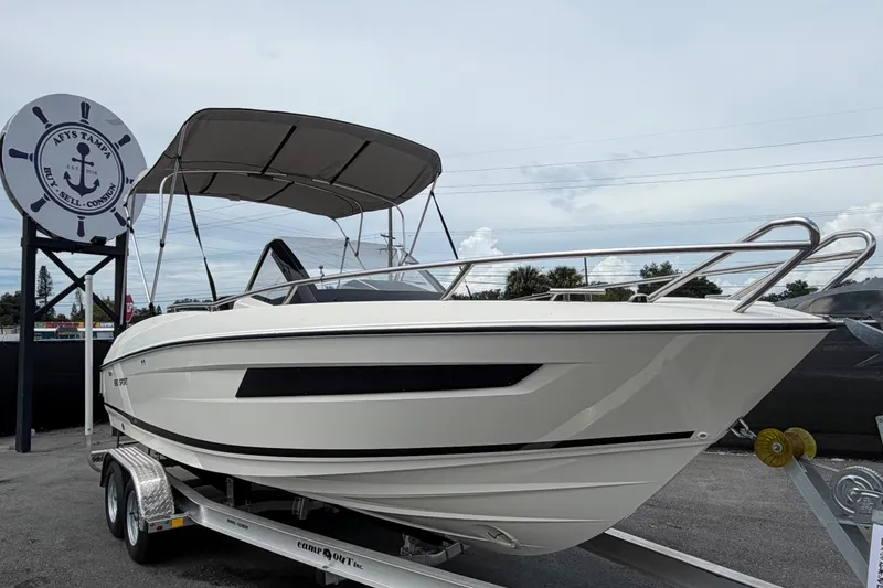 The Image of 2021 Parker Poland 690 Sport boat on trailer, displayed outdoors. - 0