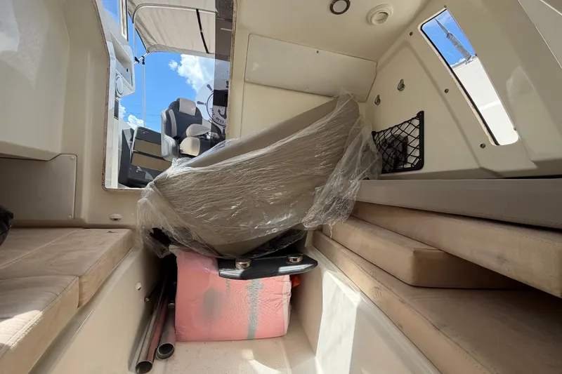 Slide: The Image of Interior cabin of 2021 Parker Poland 690 Sport boat with seating and storage. - 38