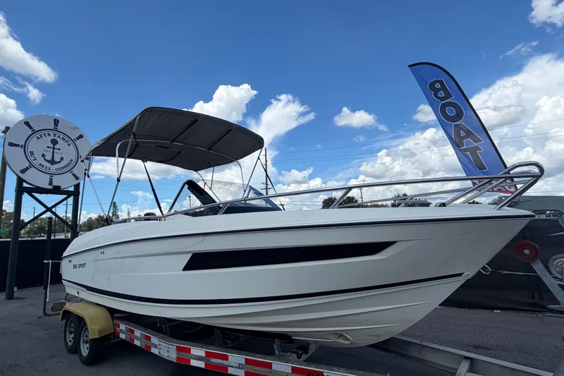 The Image of 2021 Parker Poland 690 Sport boat on trailer under blue sky. - 0