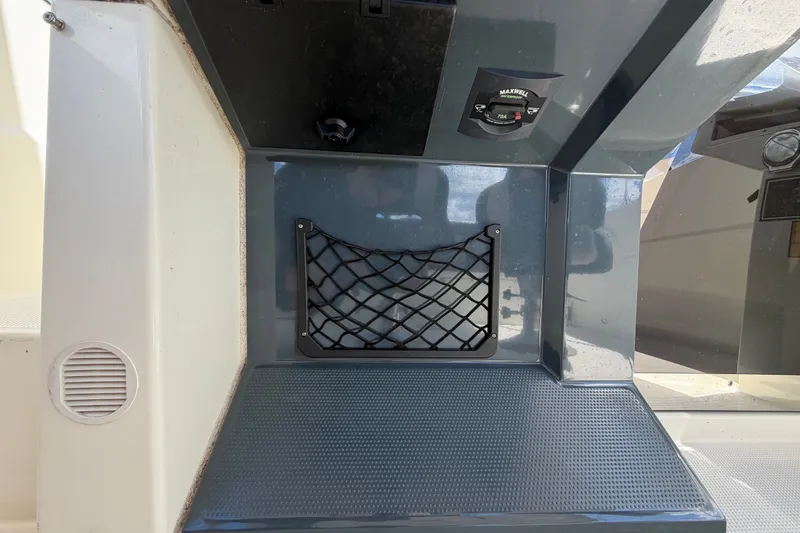 Slide: The Image of Interior detail of 2021 Parker Poland 690 Sport boat with storage net and control panel. - 28