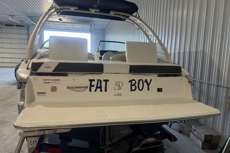 Slide: The Image of 2021 Regal LS2 boat named "Fat Boy" in a storage facility. - 5