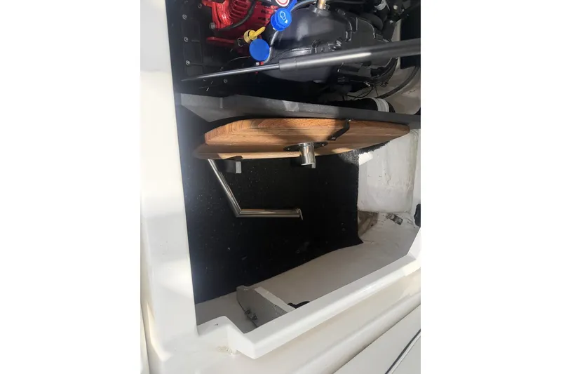 Slide: The Image of 2021 Regal LS2 engine compartment with wooden cover and visible components. - 11