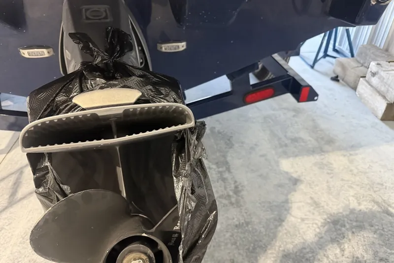 Slide: The Image of 2021 Regal LS2 boat propeller wrapped in black plastic, parked on a trailer. - 6