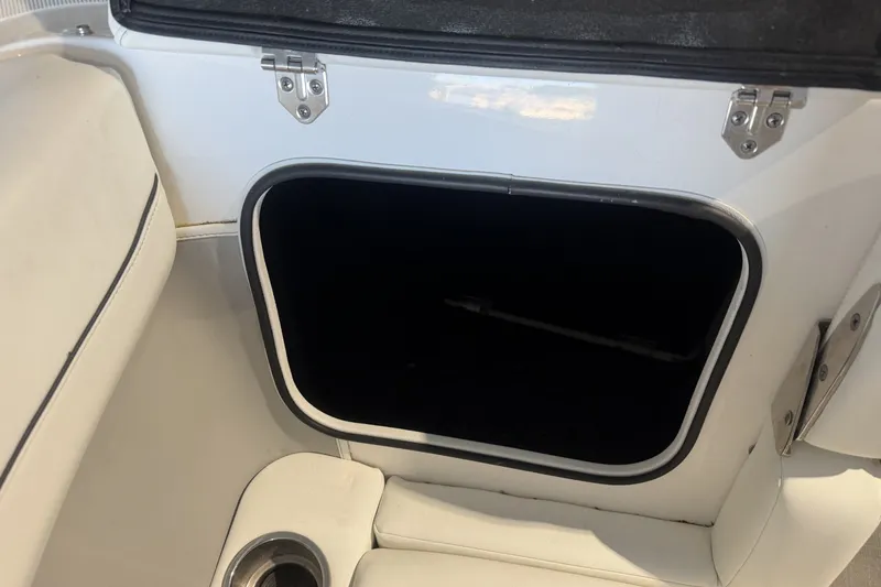 Slide: The Image of Open storage compartment in 2021 Regal LS2 boat interior. - 24