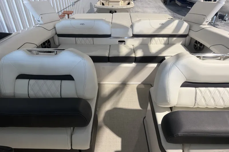 Slide: The Image of Luxurious interior of a 2021 Regal LS2 boat with elegant white seating. - 14