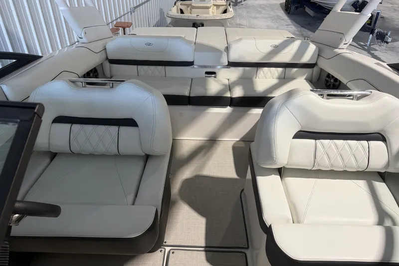 Slide: The Image of Luxurious interior of a 2021 Regal LS2 boat with plush white seating. - 18