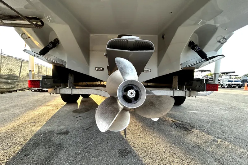 Slide: The Image of Rear view of a 2021 Regal 26 FasDeck boat on a trailer, showcasing the propeller. - 5