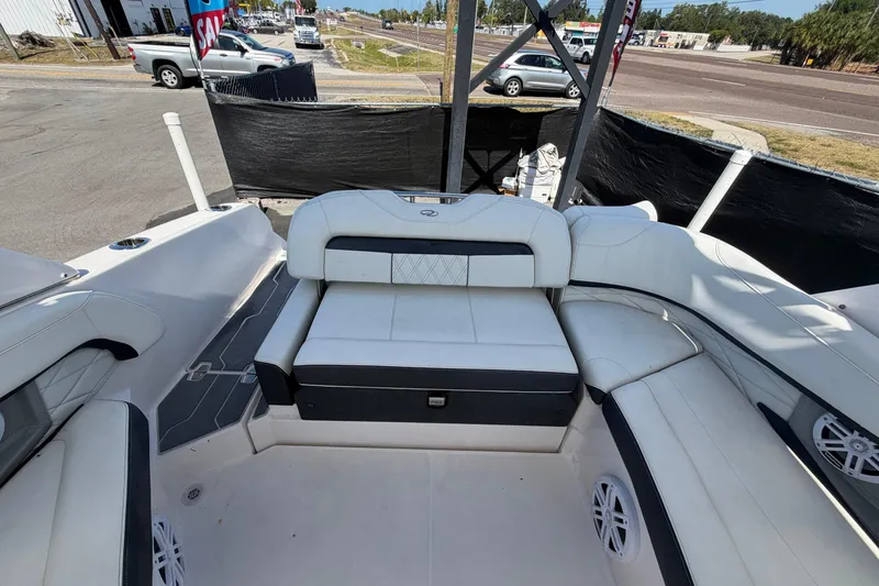 Slide: The Image of 2021 Regal 26 FasDeck boat interior with white seating and modern design. - 78
