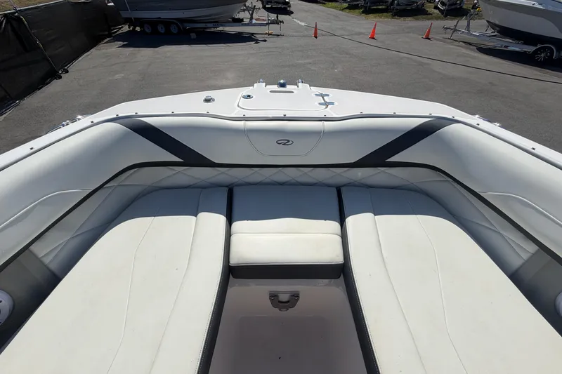 Slide: The Image of 2021 Regal 26 FasDeck boat interior with white cushioned seating. - 47