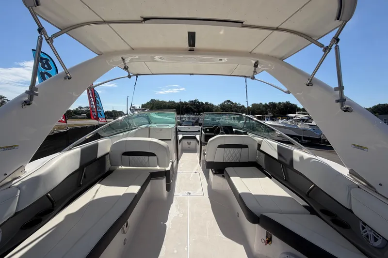 Slide: The Image of Interior view of a 2021 Regal 26 FasDeck boat with seating and canopy. - 25