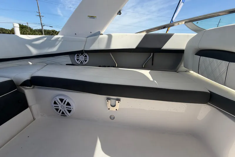 Slide: The Image of Interior seating of 2021 Regal 26 FasDeck boat with white and black upholstery. - 70