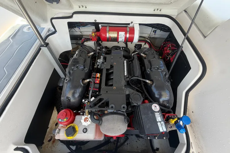 Slide: The Image of Engine compartment of a 2021 Regal 26 FasDeck boat, showcasing detailed mechanical components. - 76
